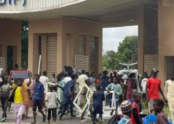 BREAKING: Office equipment and others looted as Kano protesters set NCC building on fire