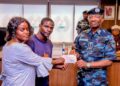 Inspector-General of Police Presents Insurance Cheques to Families of Fallen Officers.